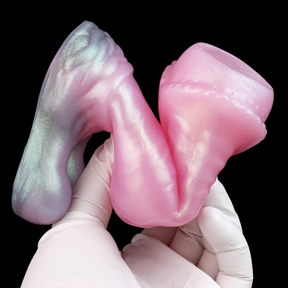Wolf-sleeve & sheath held in white gloves; pink and iridescent gray finish