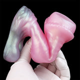 Wolf-sleeve & sheath held in white gloves; pink and iridescent gray finish