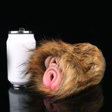 Brown furry masturbator with pink dual tip openings on a curved body