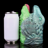Dragon Fleshlight next to white bottle for scale, green-and-blue textured creature body
