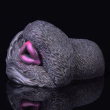 Side view with purple opening, textured dark gray dual-hole vibrating masturbator
