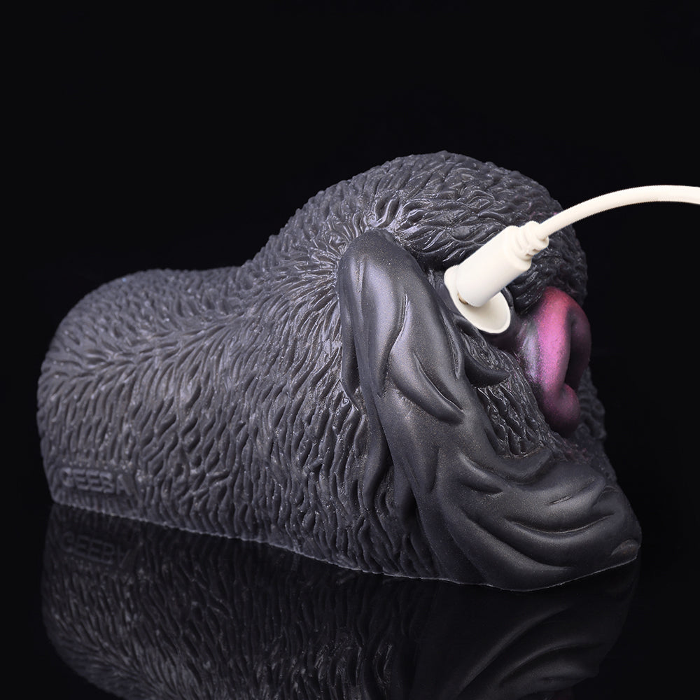 Side view of textured animal-shaped dual-hole vibrator with white plug accessory
