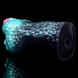 Dark open-ended sleeve of alien stroker with teal ridged surface, close end view
