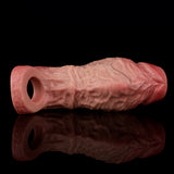 Realistic penis extender sleeve side view, open end and raised textured body