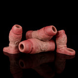 Realistic penis sleeves with open ends, varied sizes arranged