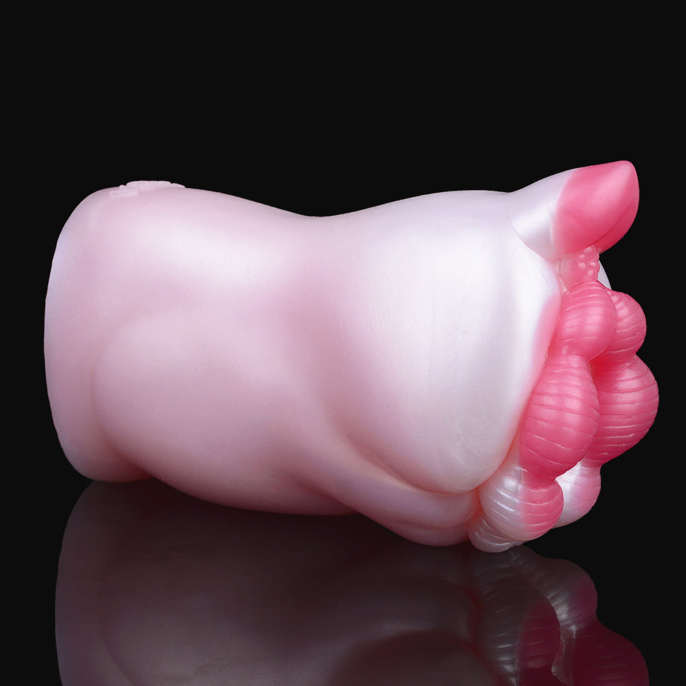 Smooth white pocket masturbator body with pink end detail, side close-up