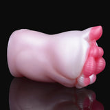 Smooth white pocket masturbator body with pink end detail, side close-up