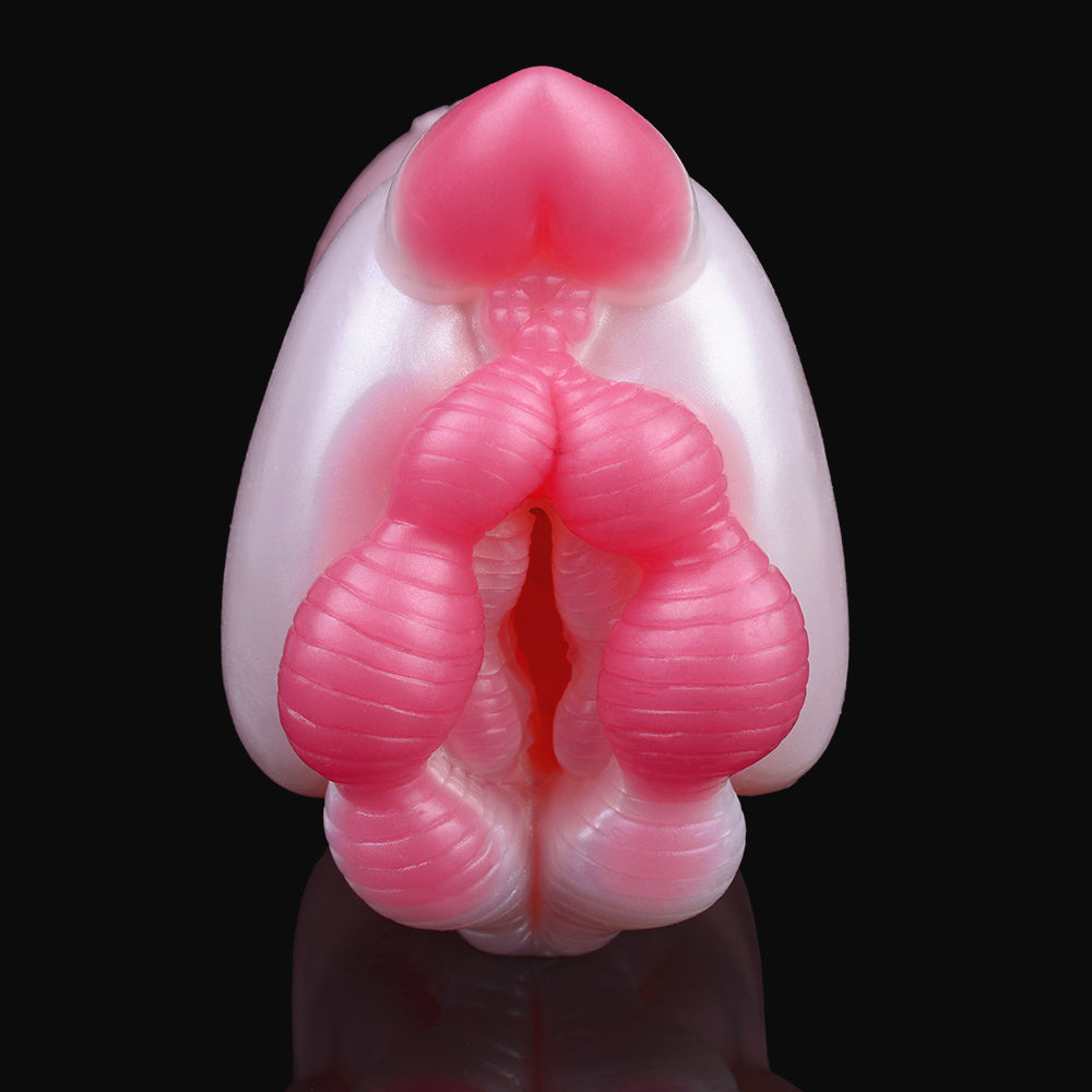Wombat face detail on pocket masturbator: pink ridged legs and rounded top, close-up