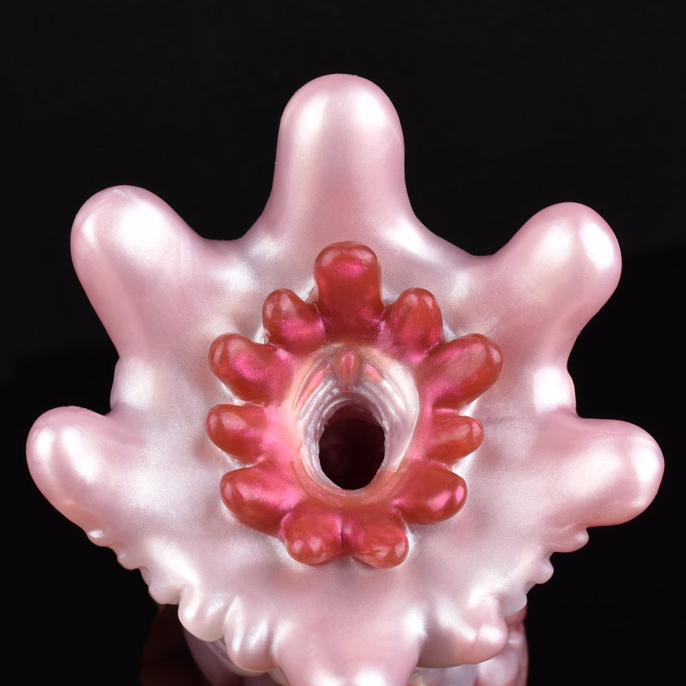 Octopus suction-ring opening on Yoyo the Tentacle, pink textured body with red tentacle details