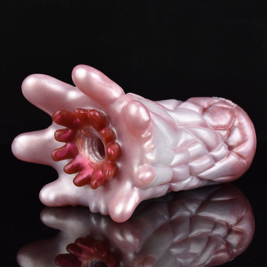 Pink octopus sex toy with curved tentacles and central opening detail