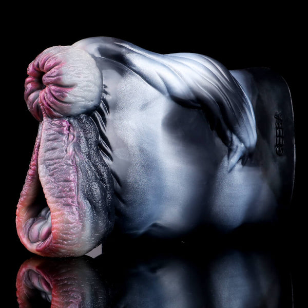 Two-hole animal-style masturbator side view showing pink mouth opening and dark inner slit