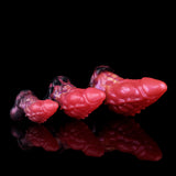 Curved dragon anal plug set, glossy pink with dark purple bases, three sizes shown