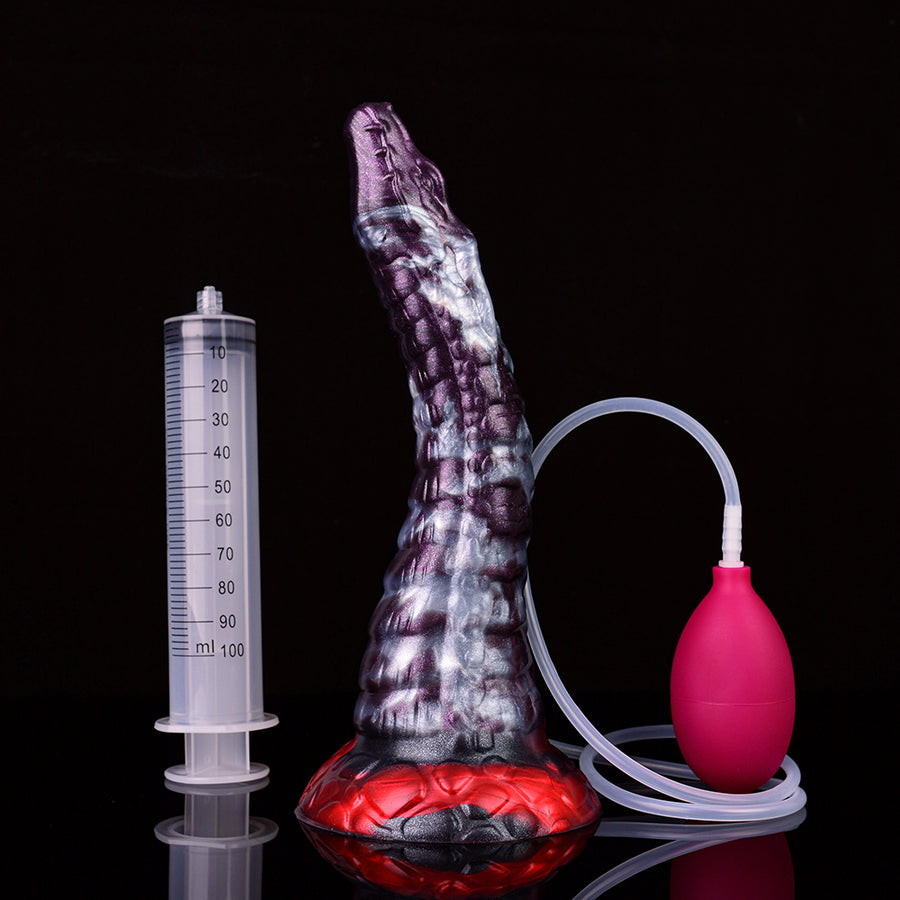 Purple-and-blue patterned dildo with red base, measuring syringe and pink pump bulb