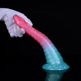 Dragon-snake dildo in pink and teal held in a gloved hand, curved shaft