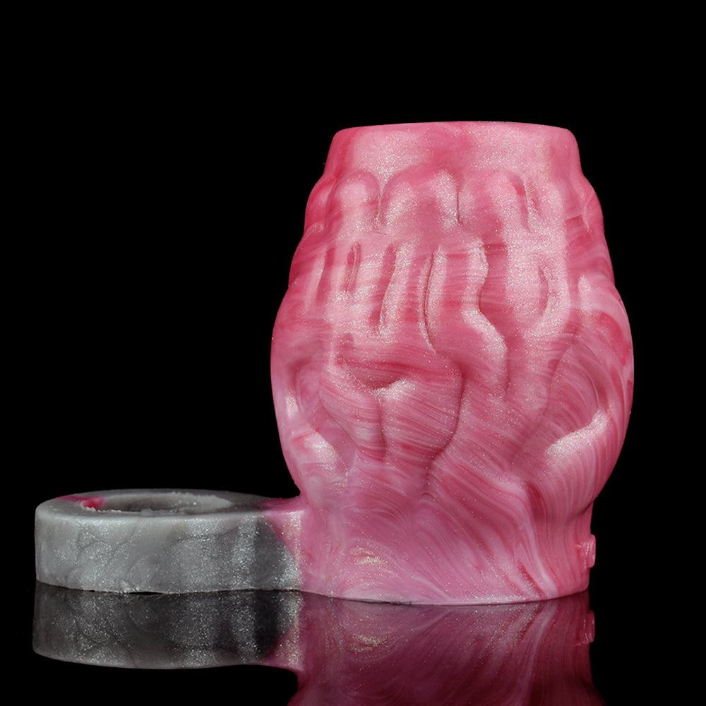 Pink ribbed sleeve ring with gray base band, close-up side view