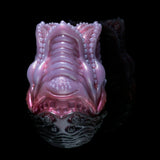 Pink silicone octopus-shaped sex toy with ridged tentacles and bubble-textured design