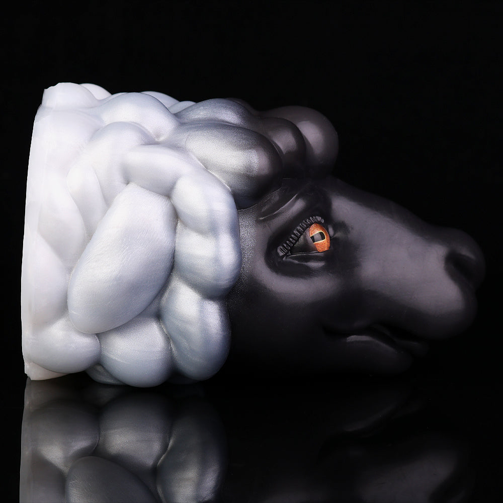 Animal figurine with black-and-white swirled mane, orange eye detail, side profile