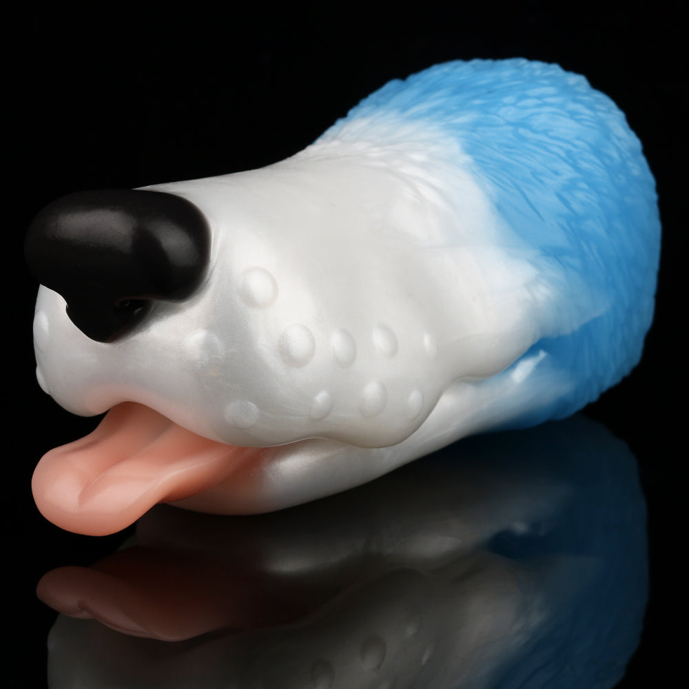 Dog-shaped toy lying on its side with white body, light blue back, and black snout