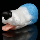 Dog-shaped toy lying on its side with white body, light blue back, and black snout