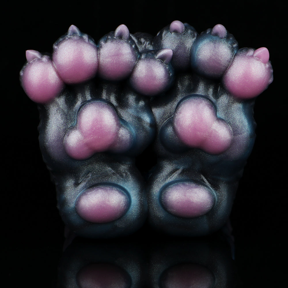 Front view of monster paw-shaped novelty toy with pink toe pads and claws