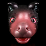 Pink and dark gray cat figurine face with red glowing eyes and curled ears
