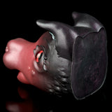 Pink and dark gray cat figurine back/side view with red eye visible