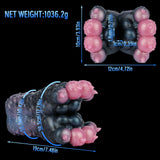 Dark blue and black textured toy with pink protrusions; size diagram and net weight text