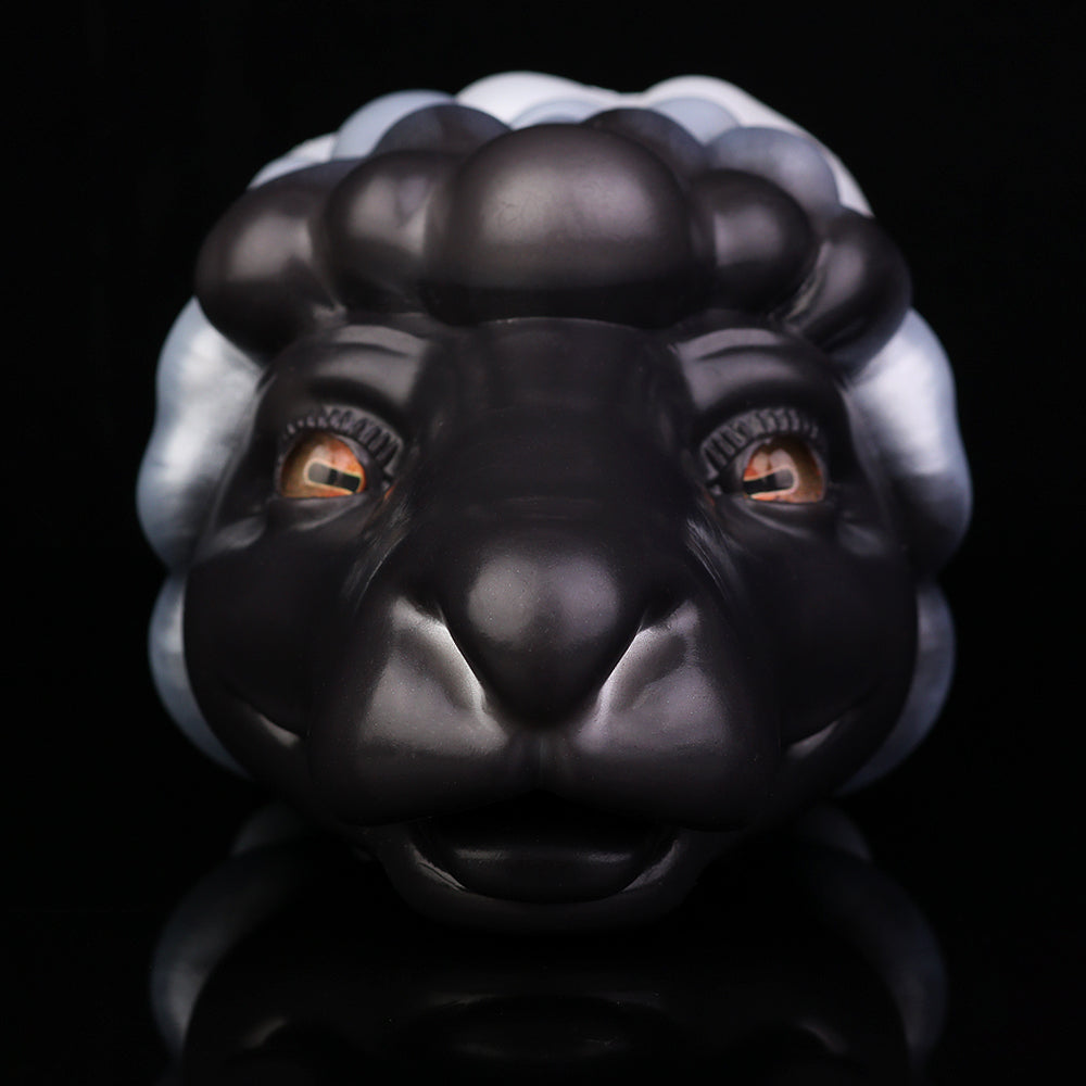 Animal figurine front view with black-and-white mane, orange eyes, rounded muzzle
