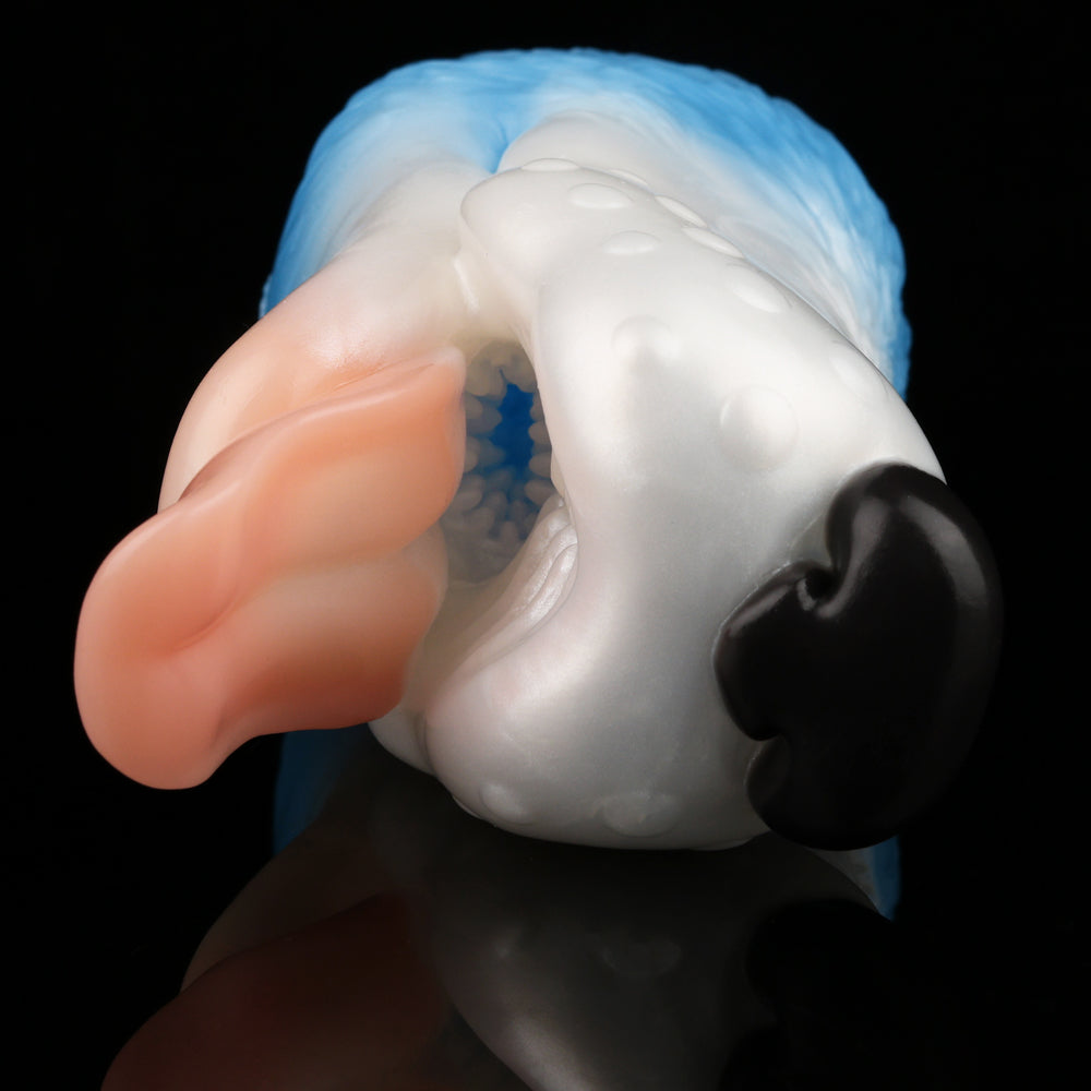 Dog-shaped toy close-up of mouth area with black nose, pink tongue, and light blue head