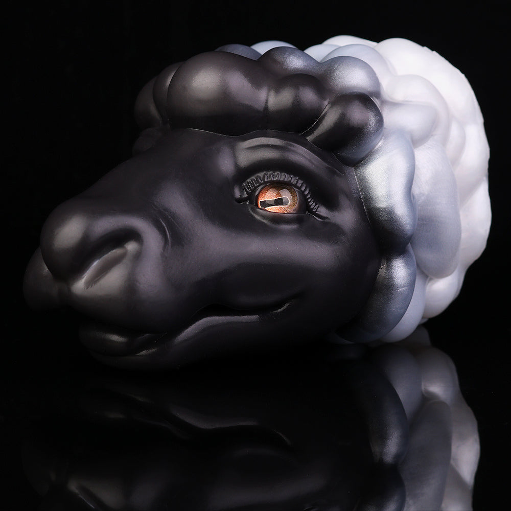 Animal figurine close-up side face, black-and-white mane, orange eye, glossy finish