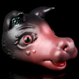 Squishy animal toy head, dark gray with pink snout and red-glossy eyes