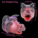 Squishy animal head toy, dark gray ears and pink face with red eyes, angled view