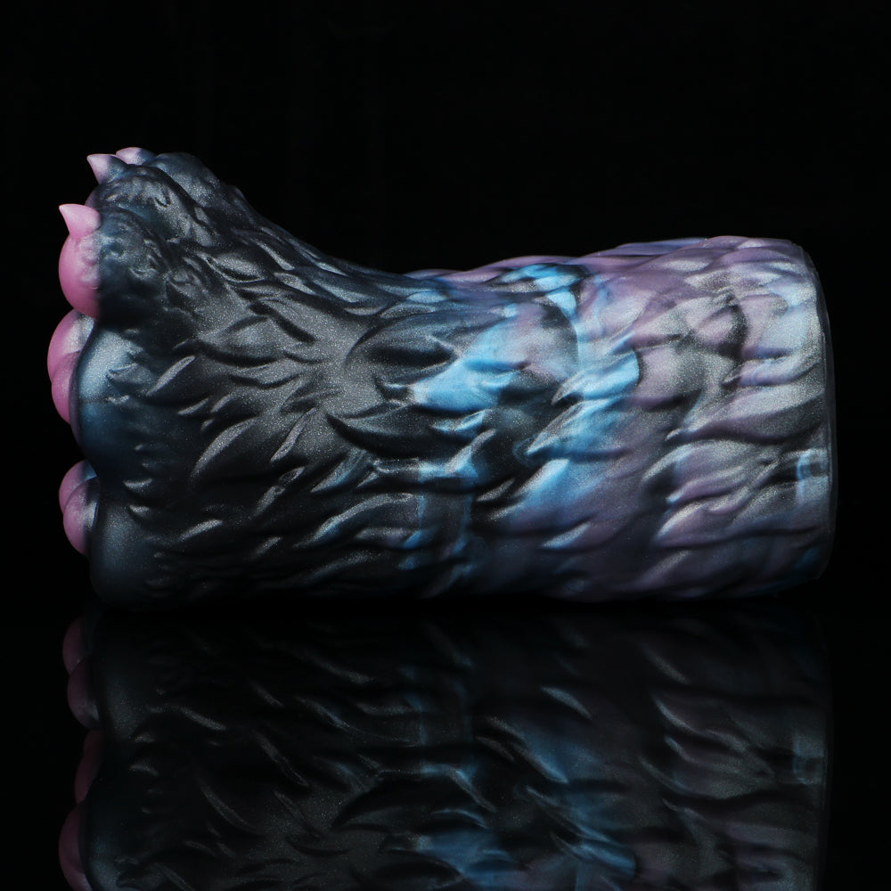 Side view of monster paw-shaped novelty toy with blue marbled texture
