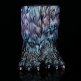 Back view of monster paw-shaped novelty toy with pink claw tips
