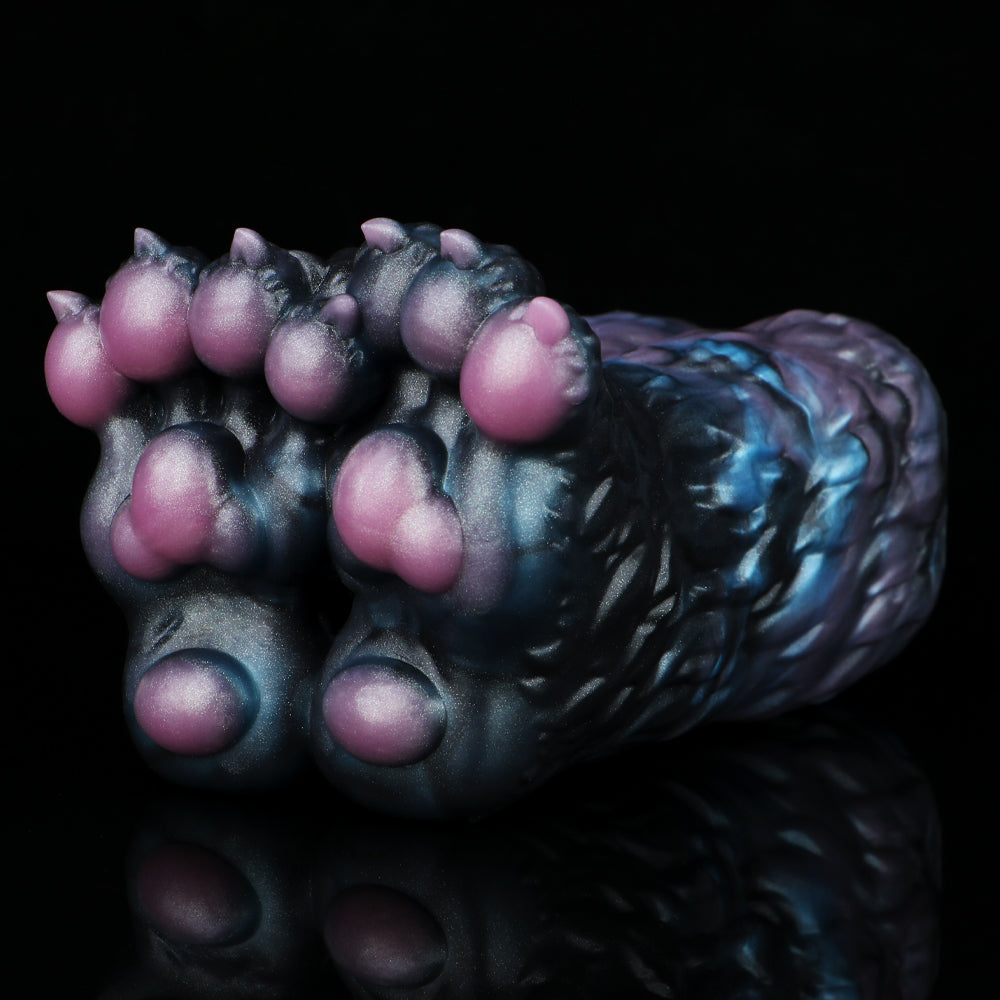 Angled view of monster paw-shaped novelty toy with dark blue fur texture