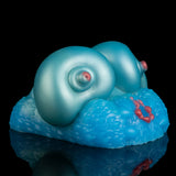 Teal silicone breast-shaped sex toy with visible nipple circles and textured base