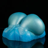Teal and blue breast-shaped silicone sex toy with sculpted seam lines