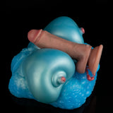 Teal silicone breast-shaped sex toy with textured base and nipple details