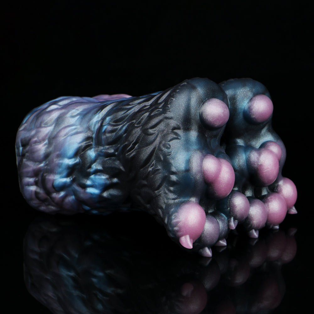 Monster paw-shaped novelty toy in dark blue with pink claw pads