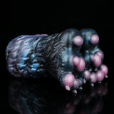 Monster paw-shaped novelty toy in dark blue with pink claw pads