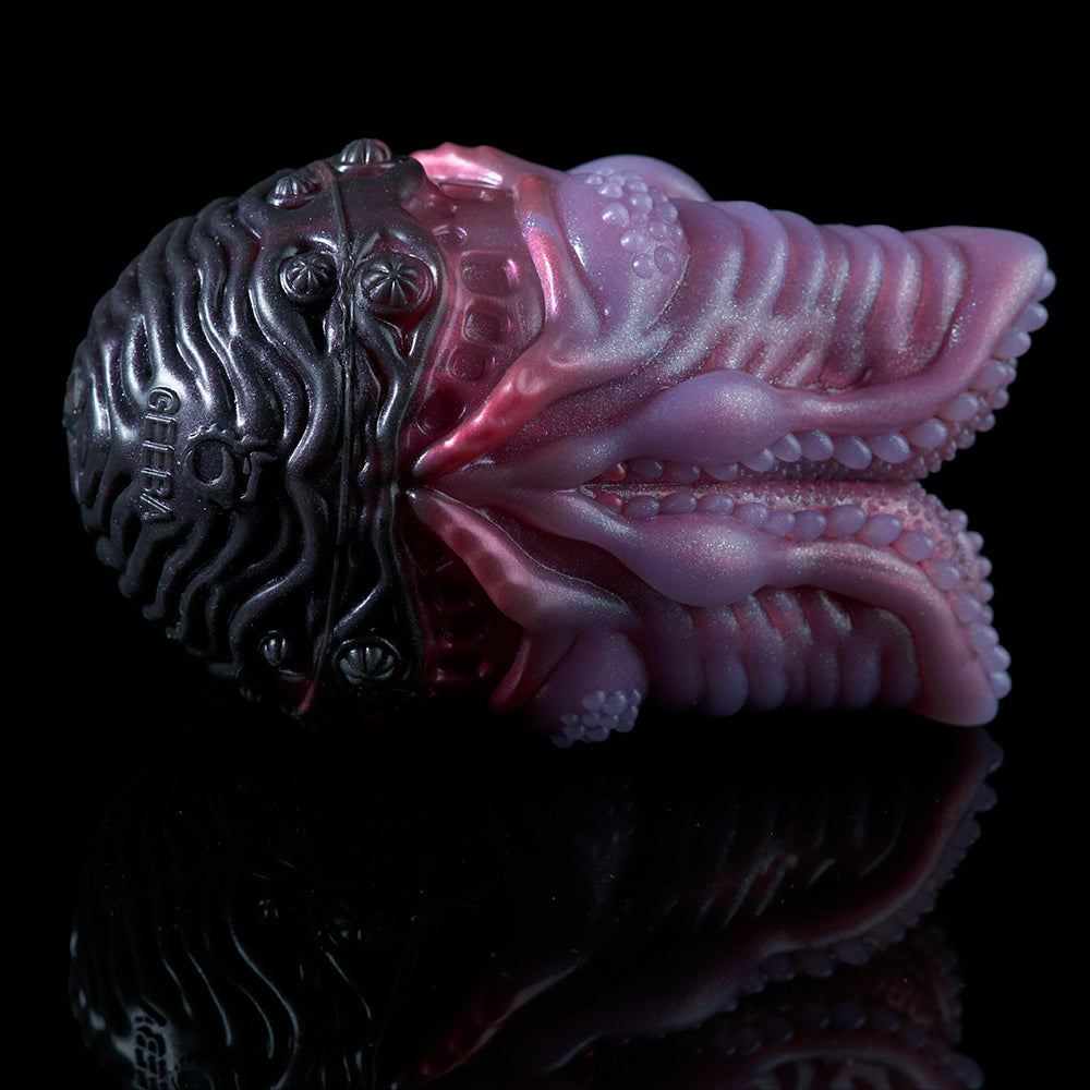 Octopus-themed silicone sex toy, dark purple and pink, detailed tentacles and head