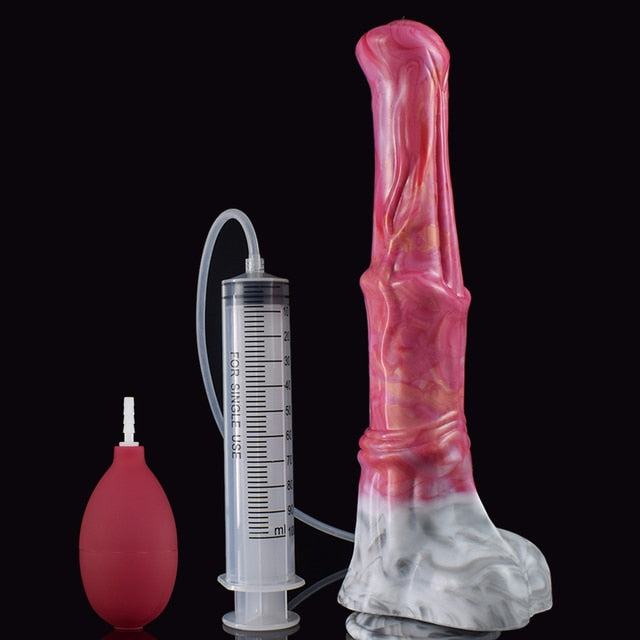 Pink translucent novelty dildo with clear base beside syringe and red pump bulb.