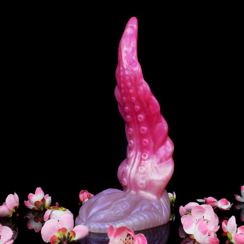 Aufrechte Ansicht des Oktopus-Buttplugs; dickes Fußteil, hochstehender Tentakel, rosa/pink