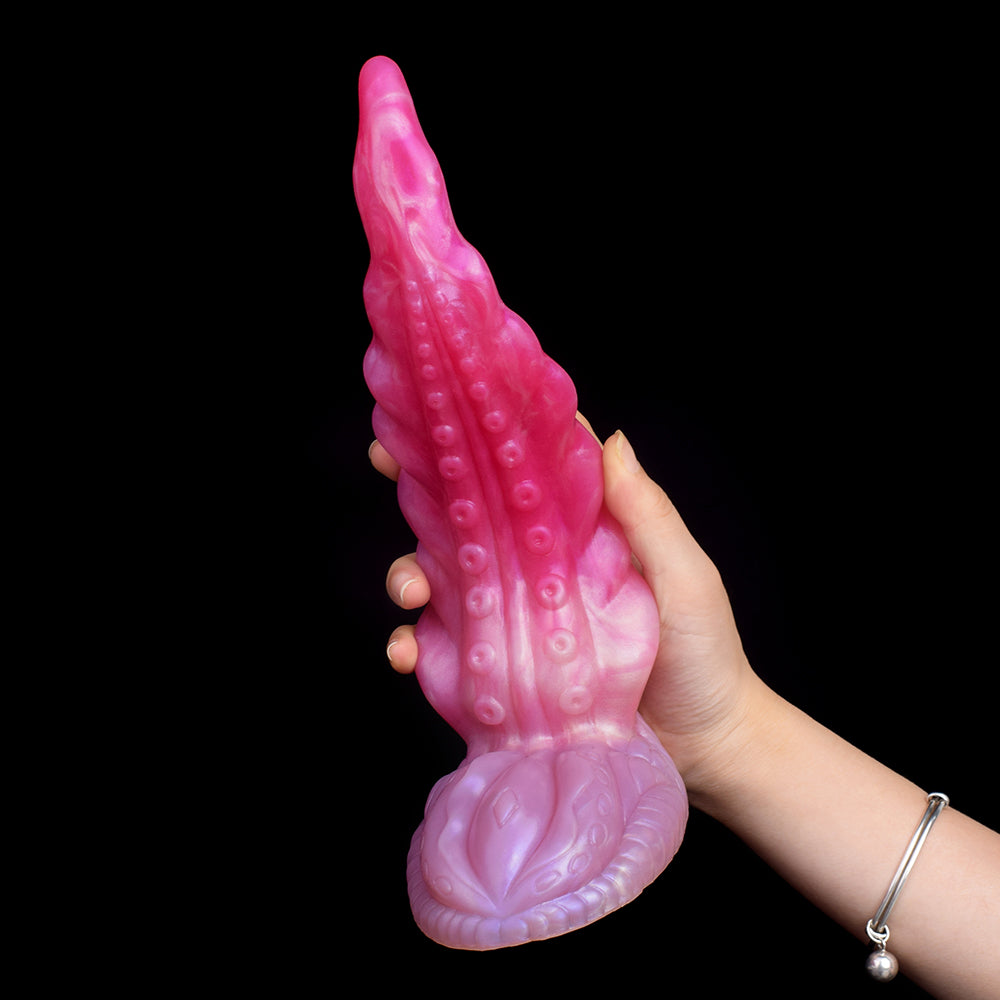 Oktopus-Buttplug mit deutlich sichtbarem Fußteil und Tentakel, Saugnoppen-Relief, pink