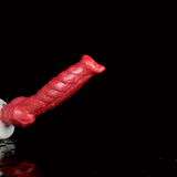 Red textured dildo detail with white base and clear tube, end toward left
