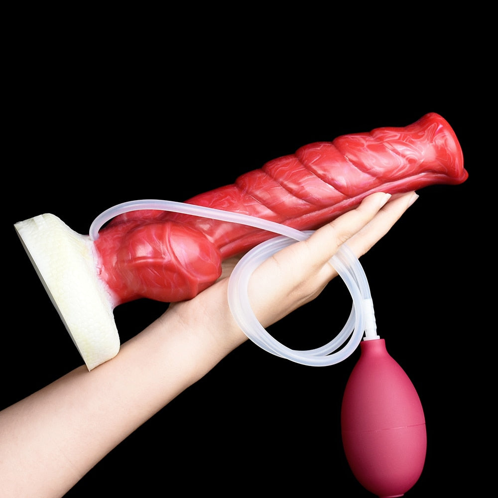 Red textured dildo with clear tube, white base, and maroon squeeze bulb