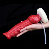 Red textured dildo with white base and clear tube held in hand