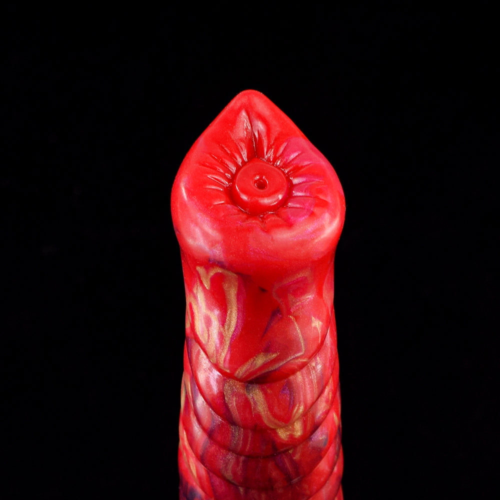 Red wolf-nose tip with central opening on the sculpted dildo head