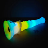 Front view of the flared base on a blue-to-rainbow luminous vibrator