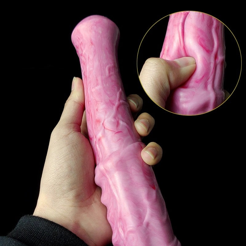 Pink translucent horse-shaped adult toy held in hand, detailed texture close-up
